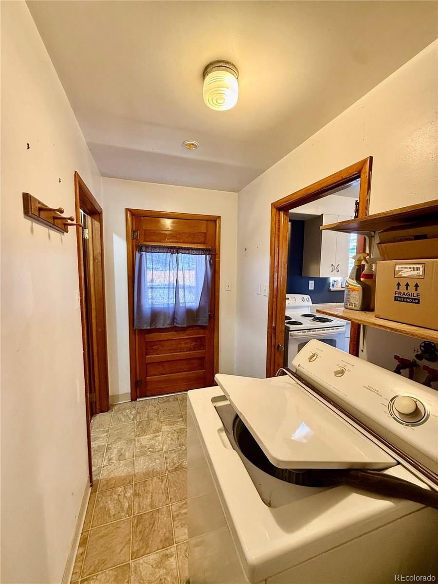 215 Main Street Cheraw, CO 81030 - Photo 12 of 17 a bedroom with a bed and a large mirror on the dresser
