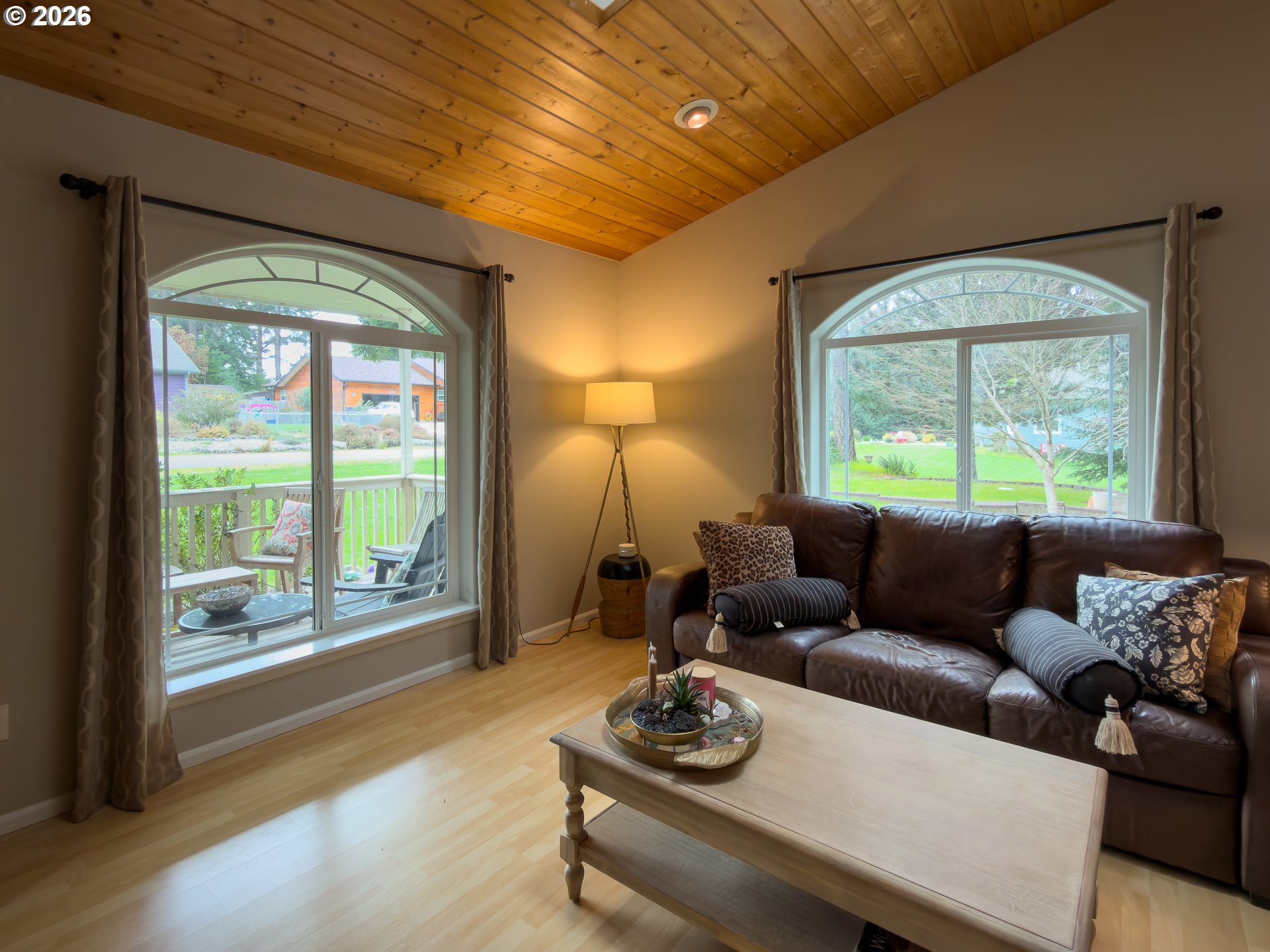 1185 11th Street Southeast Bandon, OR 97411 - Photo 11 of 48 a living room with furniture and a window