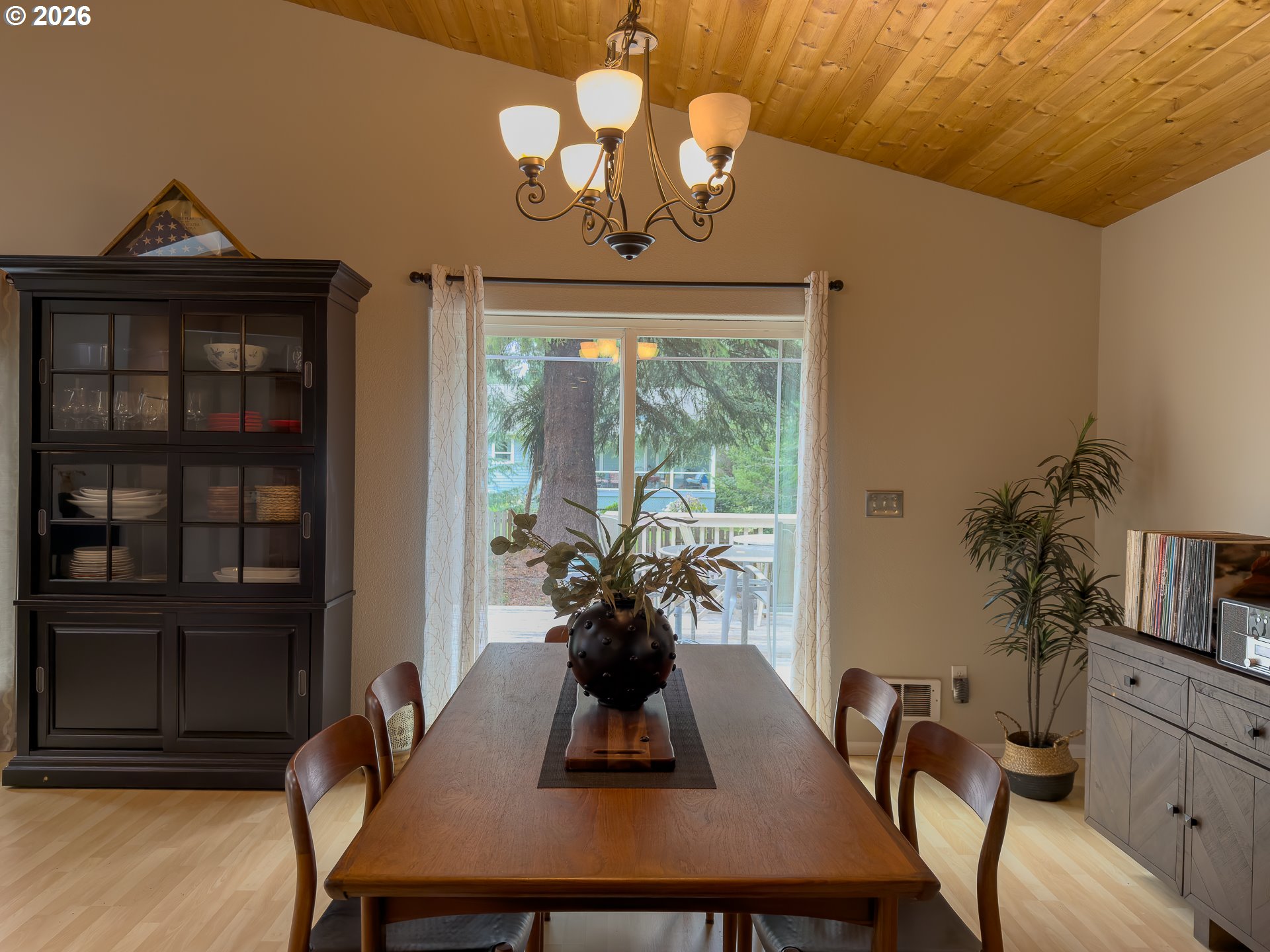 1185 11th Street Southeast Bandon, OR 97411 - Photo 13 of 48 a view of a dining room with furniture window and wooden floor