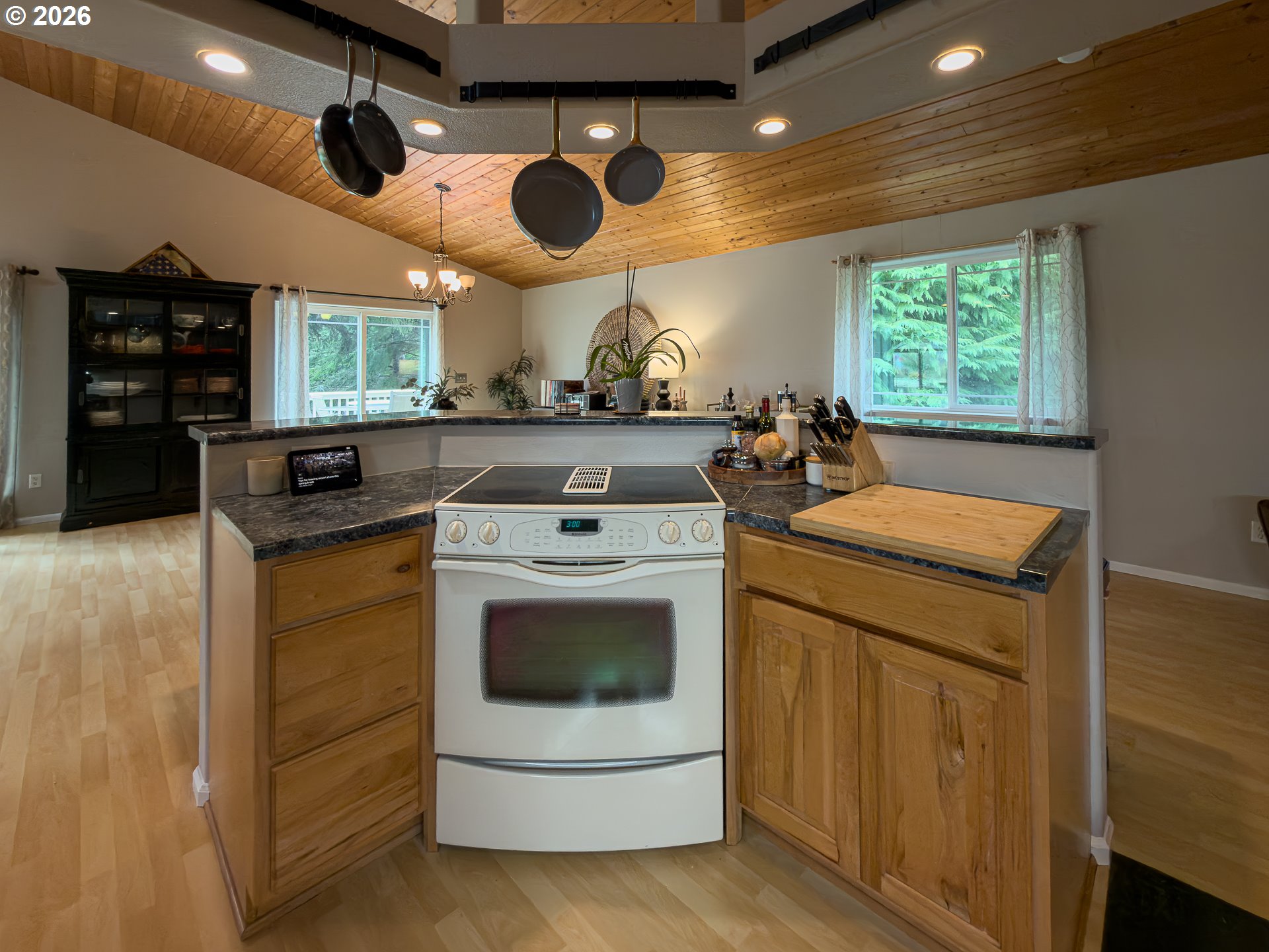 1185 11th Street Southeast Bandon, OR 97411 - Photo 20 of 48 a kitchen with a stove and a microwave