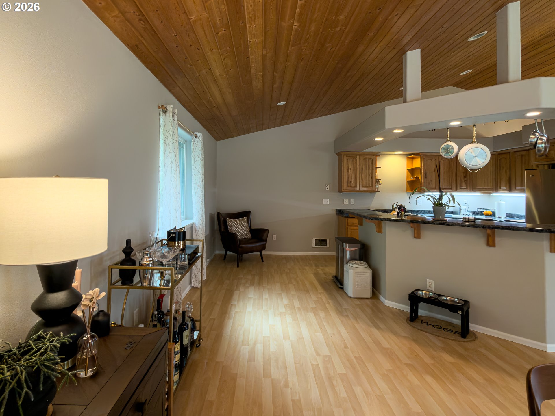 1185 11th Street Southeast Bandon, OR 97411 - Photo 21 of 48 a living room with furniture and wooden floor