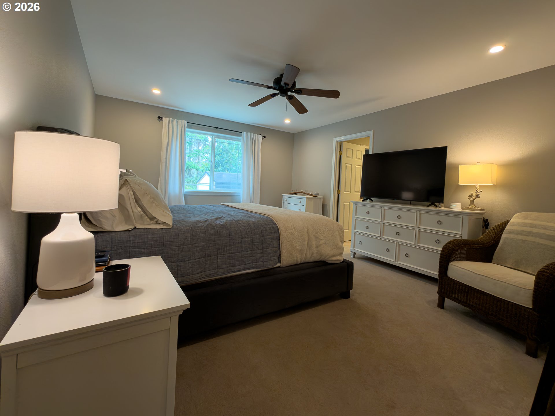 1185 11th Street Southeast Bandon, OR 97411 - Photo 23 of 48 a bedroom with a bed and a couch