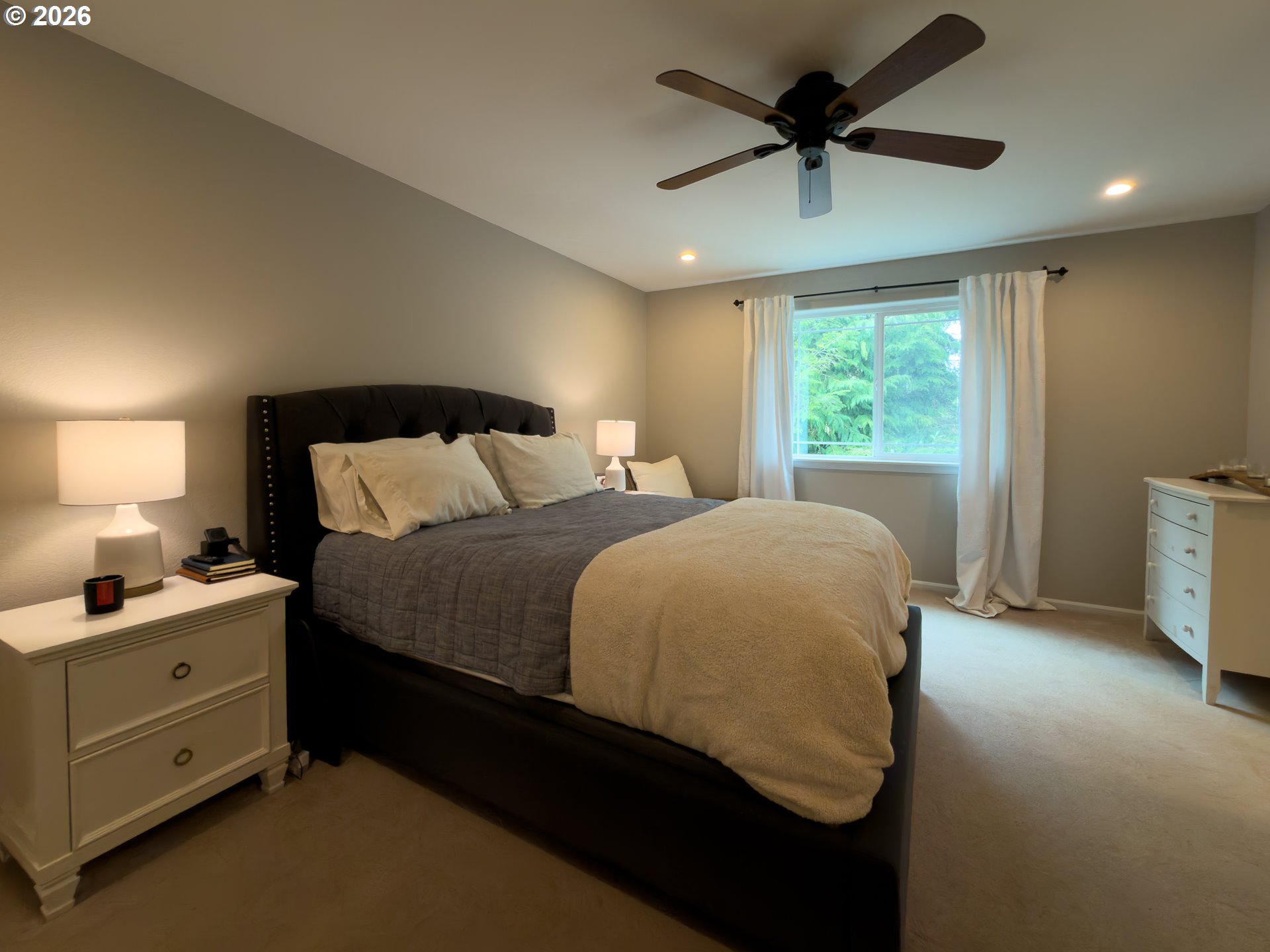 1185 11th Street Southeast Bandon, OR 97411 - Photo 24 of 48 a bedroom with a bed and a window