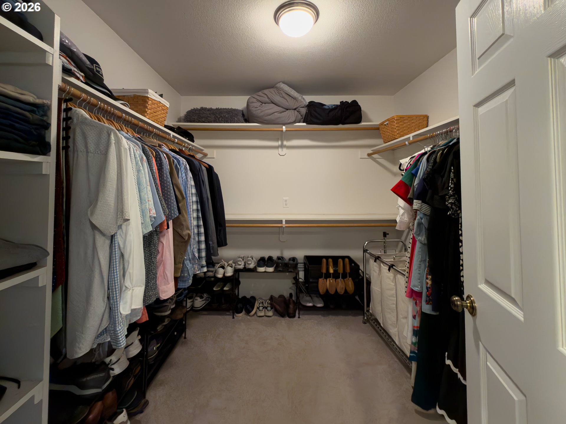 1185 11th Street Southeast Bandon, OR 97411 - Photo 28 of 48 a view of walk in closet with clothes and shoes