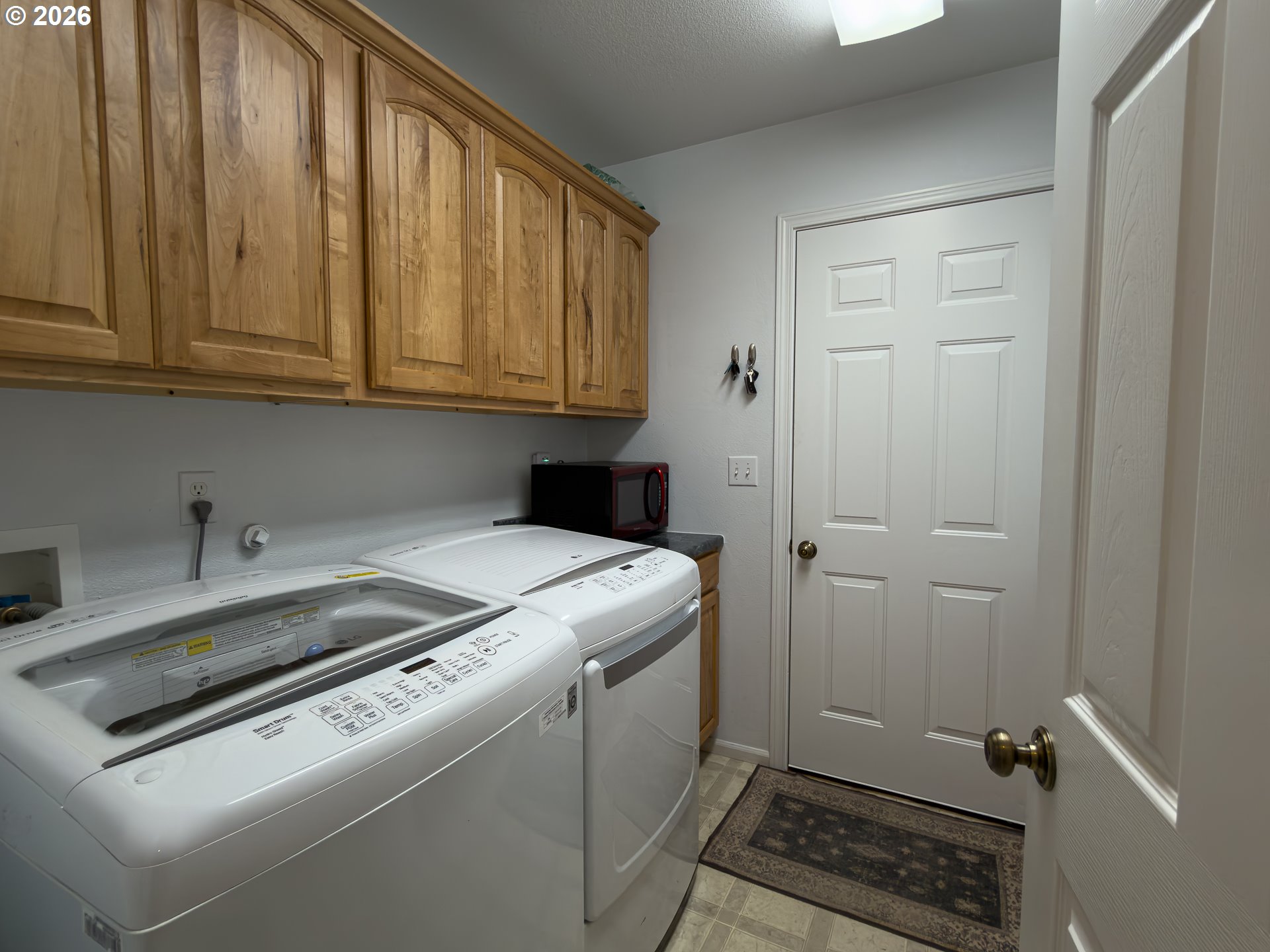 1185 11th Street Southeast Bandon, OR 97411 - Photo 34 of 48 a utility room with dryer and washer