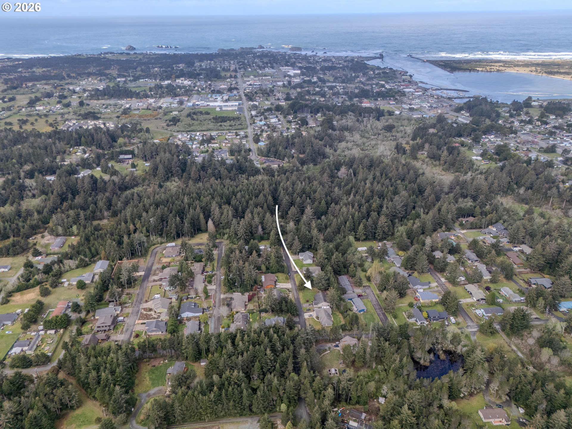 1185 11th Street Southeast Bandon, OR 97411 - Photo 4 of 48 an aerial view of multiple house