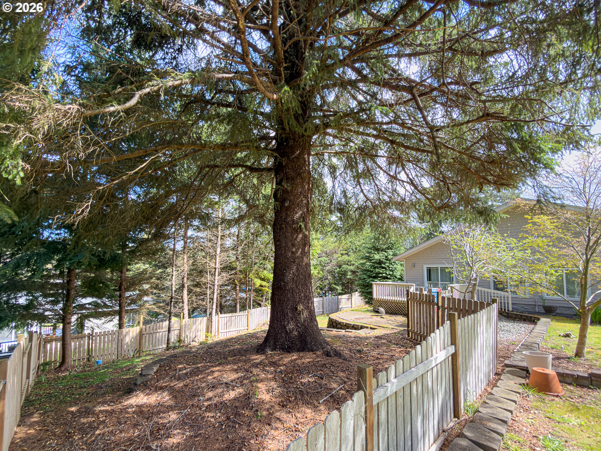 1185 11th Street Southeast Bandon, OR 97411 - Photo 41 of 48 a view of a deck and yard with swimming pool
