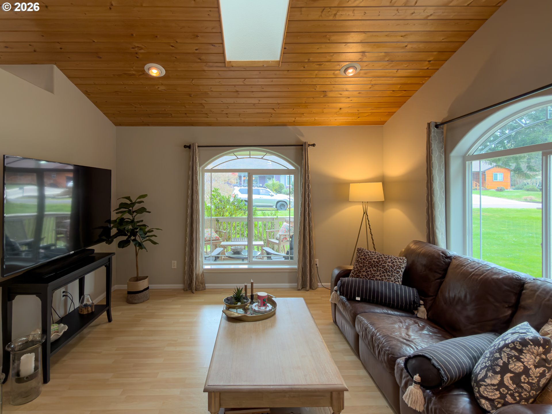 1185 11th Street Southeast Bandon, OR 97411 - Photo 10 of 48 a living room with furniture and a flat screen tv