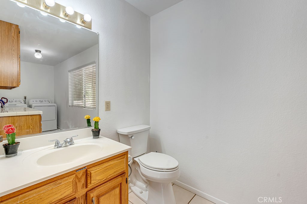 318 Old Toll Road Lake Arrowhead, CA 92352 - Photo 26 of 44 a bathroom with a sink toilet and mirror