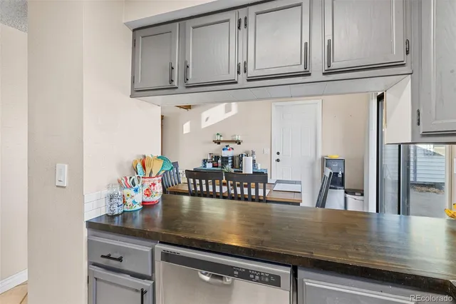 a view of living room with furniture and wooden floor