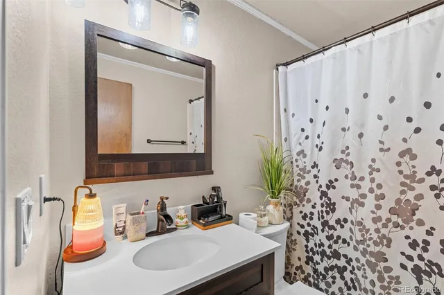 a bathroom with a sink a mirror and a sink