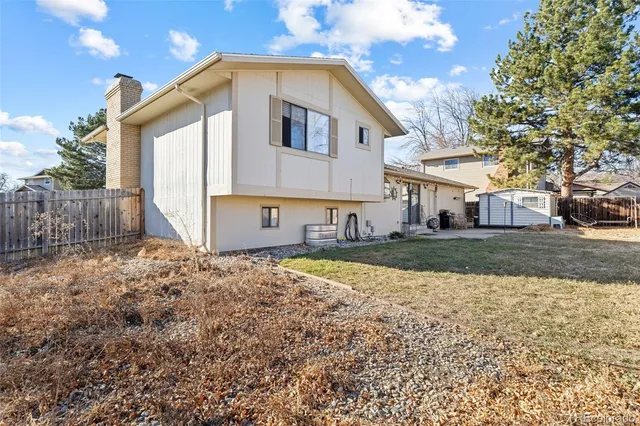 a view of a house with snow on the road