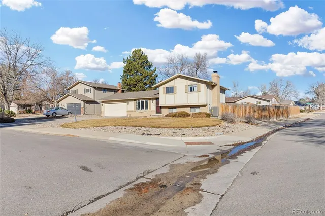 a view of multiple houses with a street