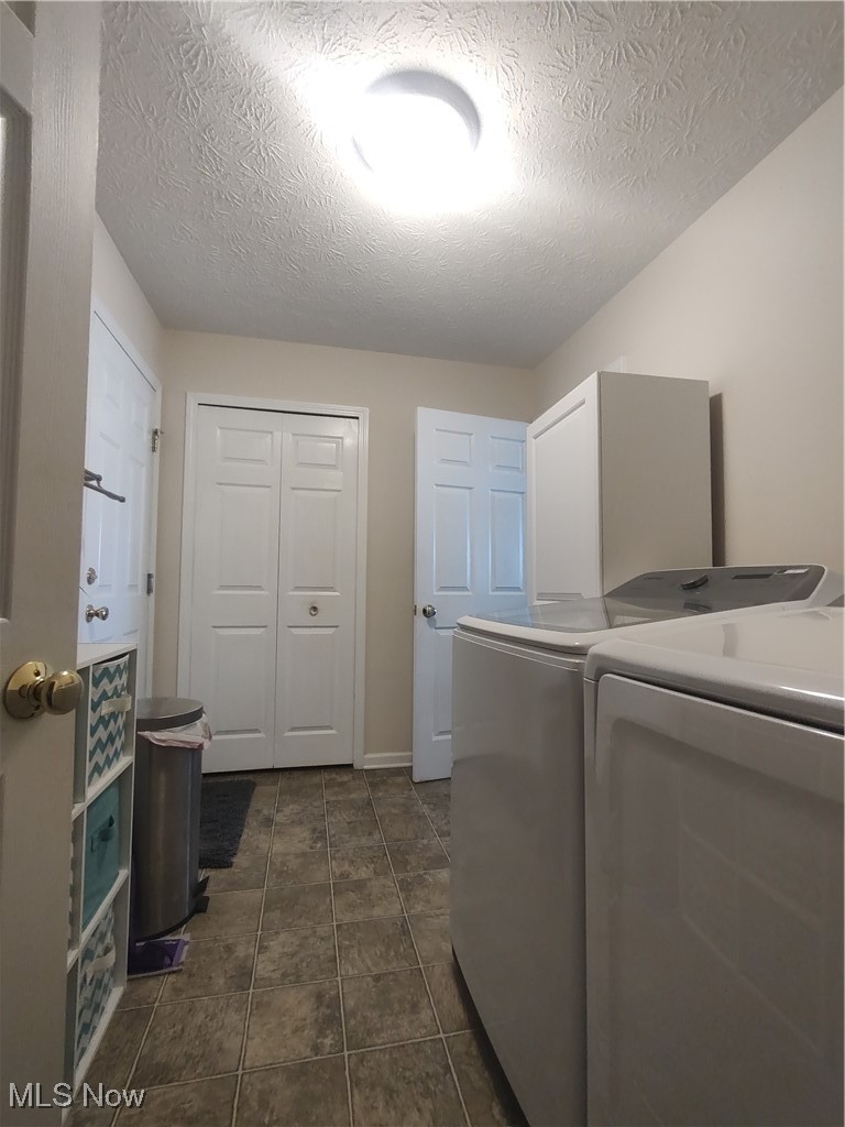 870 Susan Road Ravenna, OH 44266 - Photo 26 of 35 Washroom with a textured ceiling and separate washer and dryer