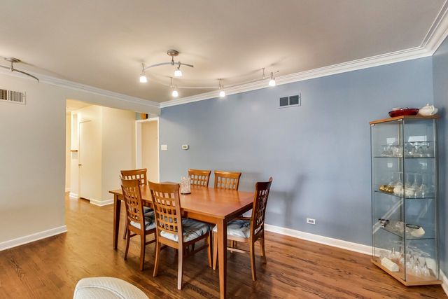 36 South Cowley Road Riverside, IL 60546 - Photo 11 of 42 a view of a dining room with furniture and wooden floor