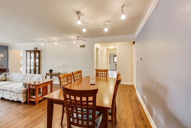 36 South Cowley Road Riverside, IL 60546 - Photo 12 of 42 a view of a dining room with furniture and wooden floor