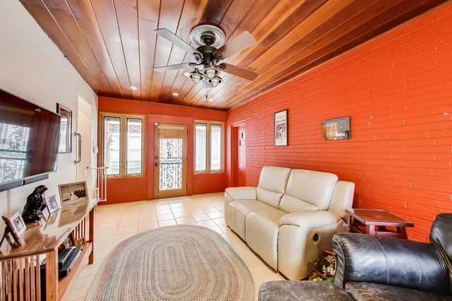 36 South Cowley Road Riverside, IL 60546 - Photo 17 of 42 a living room with furniture ceiling fan and a rug