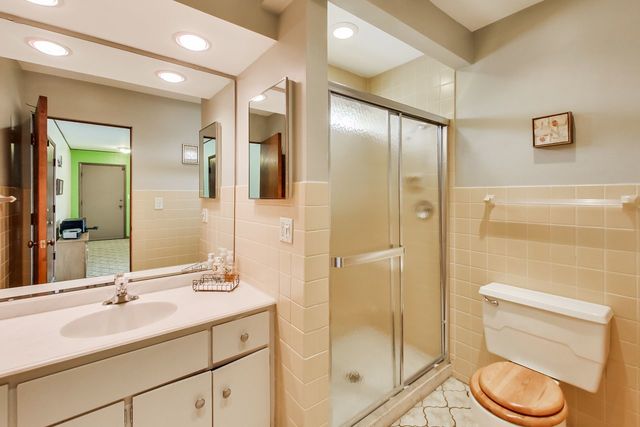 36 South Cowley Road Riverside, IL 60546 - Photo 20 of 42 a bathroom with a double vanity sink toilet and shower