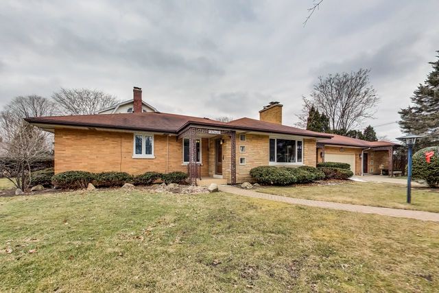 36 South Cowley Road Riverside, IL 60546 - Photo 3 of 42 a front view of a house with a yard