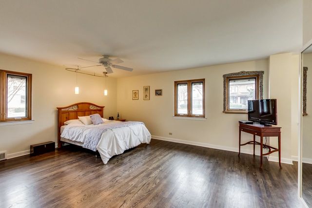 36 South Cowley Road Riverside, IL 60546 - Photo 21 of 42 a spacious bedroom with a bed and wooden floor