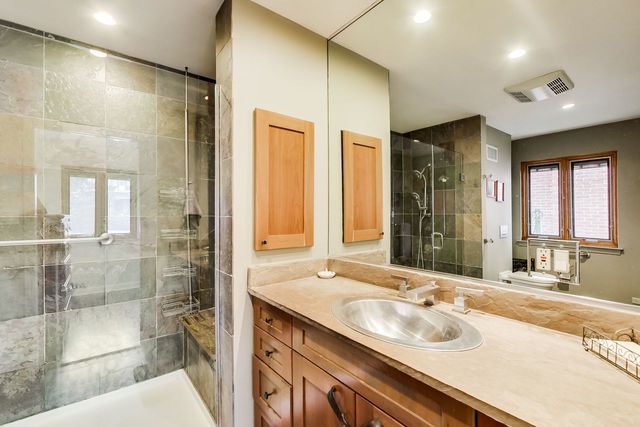 36 South Cowley Road Riverside, IL 60546 - Photo 23 of 42 a bathroom with a sink double vanity and a shower