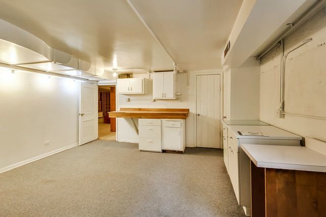 36 South Cowley Road Riverside, IL 60546 - Photo 37 of 42 a utility room with cabinets dryer and washer