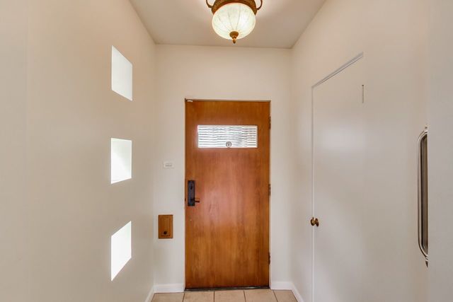 36 South Cowley Road Riverside, IL 60546 - Photo 6 of 42 a view of an entryway with table and window