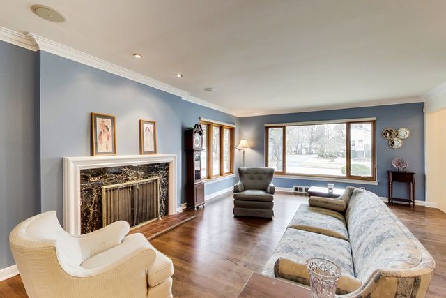 36 South Cowley Road Riverside, IL 60546 - Photo 8 of 42 a living room with furniture fireplace and a window