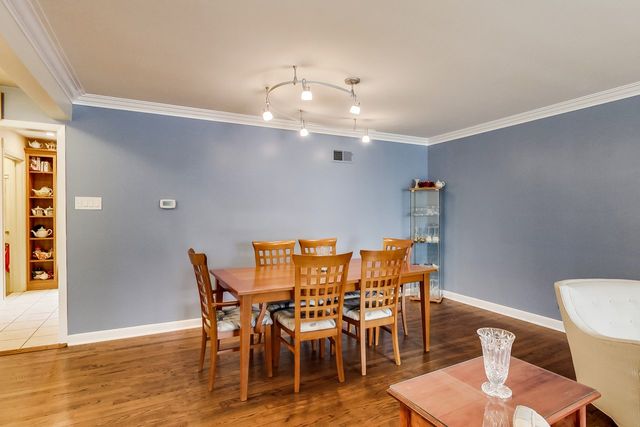 36 South Cowley Road Riverside, IL 60546 - Photo 10 of 42 a view of a dining room with furniture and wooden floor