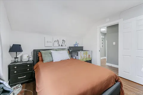 a bedroom with a bed and a dresser in it