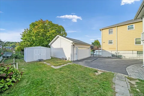 a view of a parking space with a patio