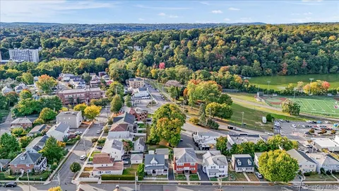an aerial view of residential building with parking