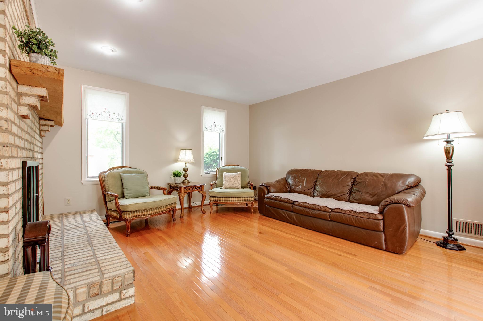 5519 Woodbine Road Sykesville, MD 21784 - Photo 15 of 69 a living room with furniture and a lamp
