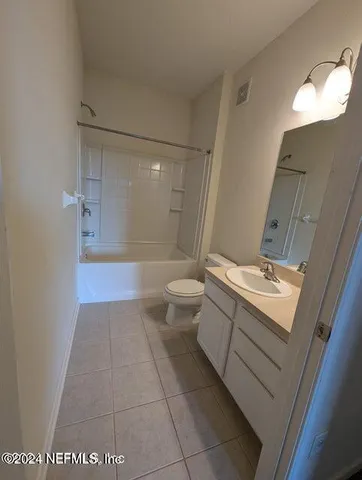 a view of a balcony with wooden floor