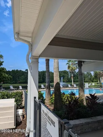 a view of a porch with seating space