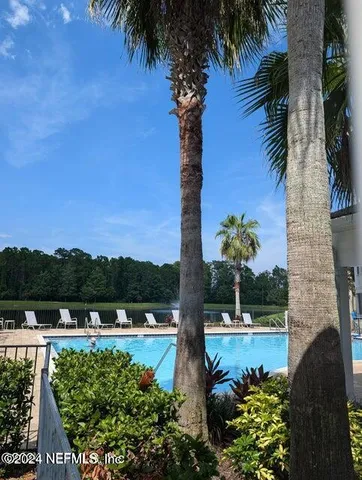 a front view of a house with garden and patio