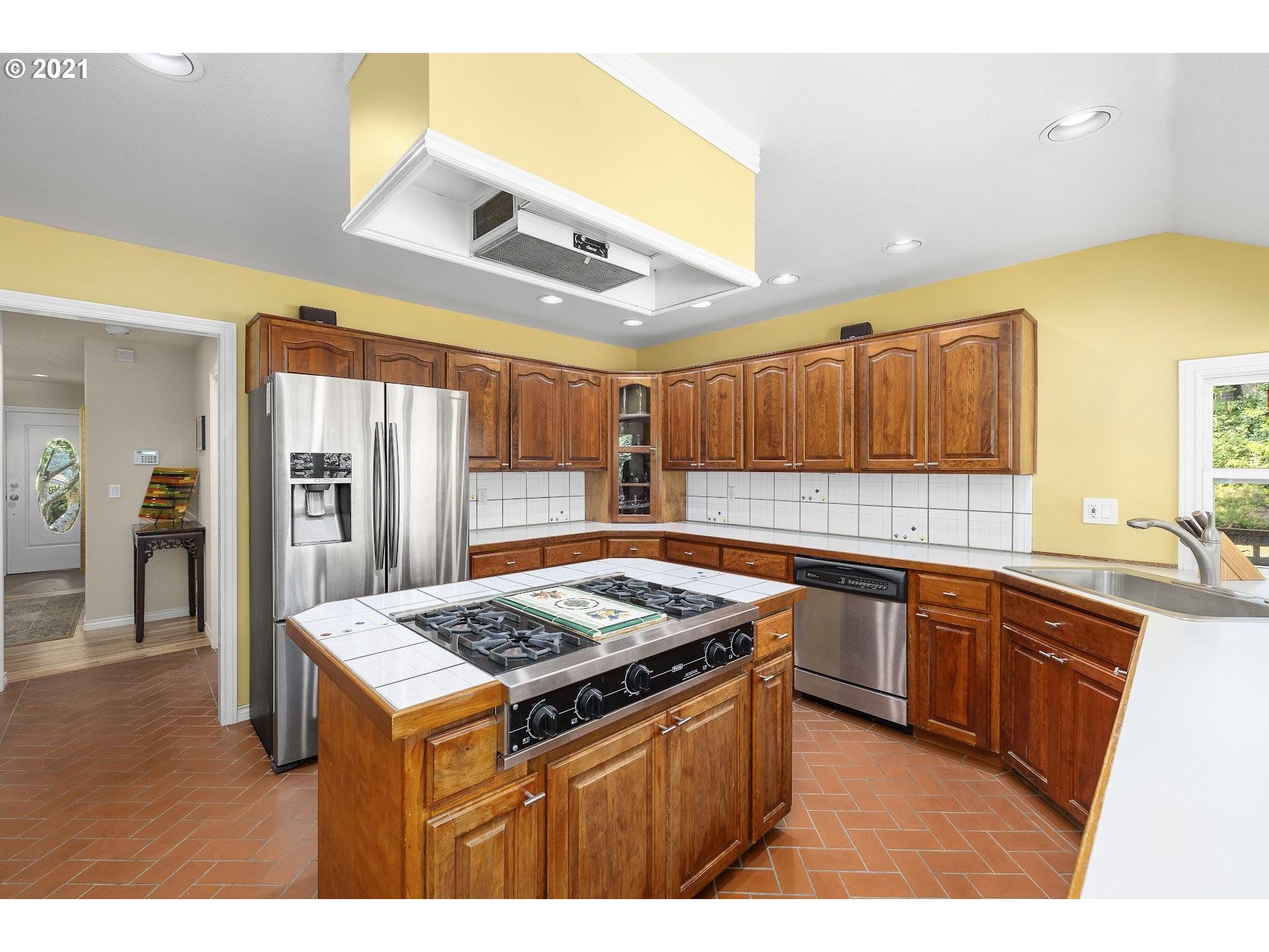 3916 Southwest Shattuck Road Portland, OR 97221 - Photo 12 of 28 a kitchen with a sink a counter top space and appliances