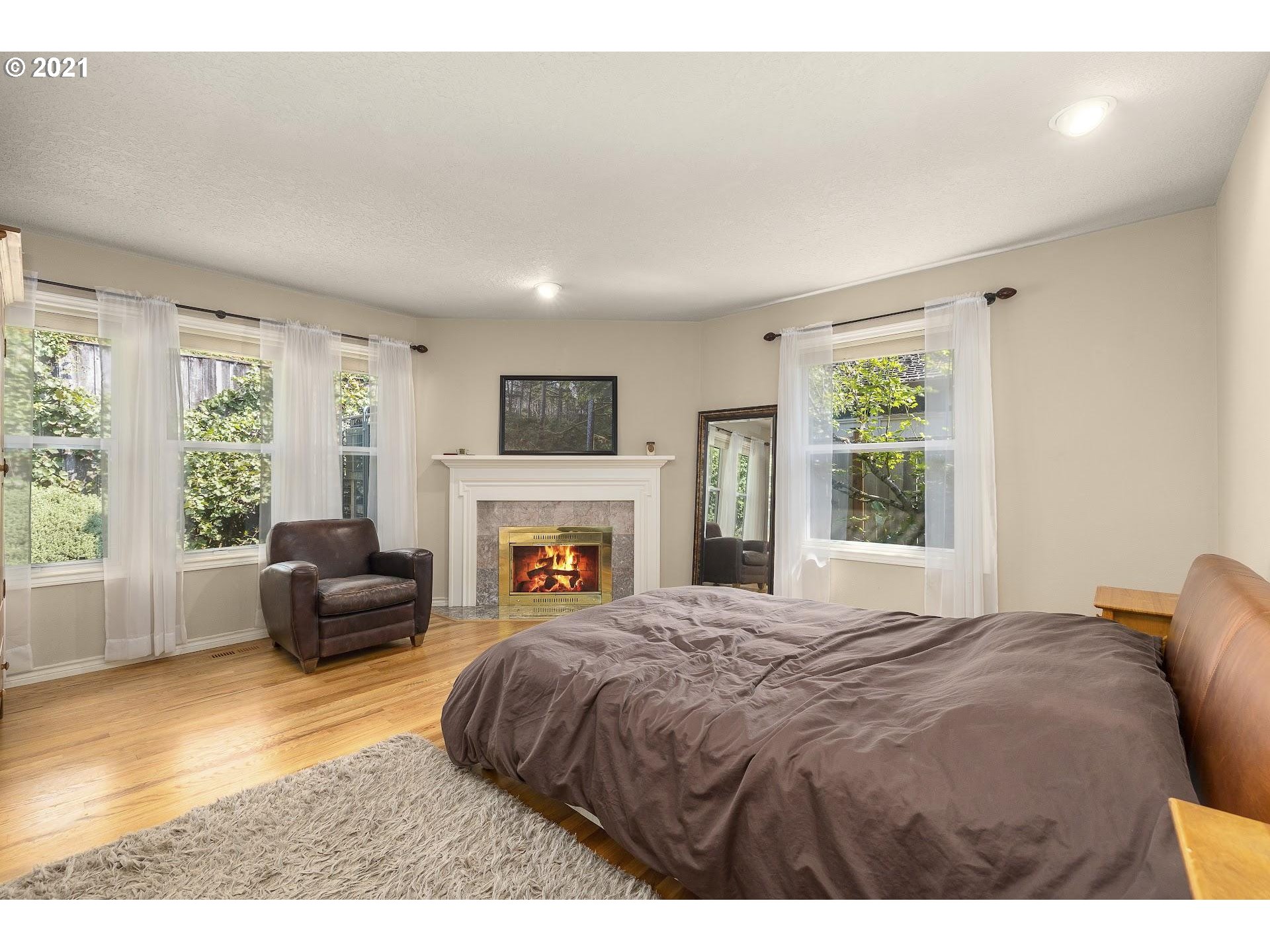 3916 Southwest Shattuck Road Portland, OR 97221 - Photo 15 of 28 a bedroom with a bed and a couch