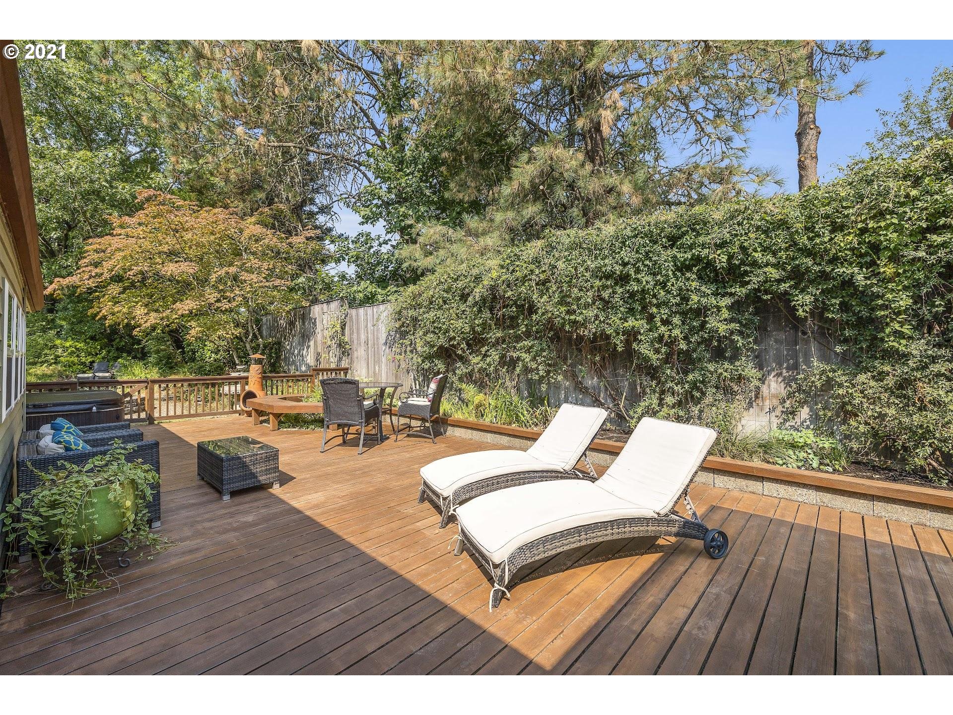 3916 Southwest Shattuck Road Portland, OR 97221 - Photo 21 of 28 a balcony with wooden floor and outdoor seating