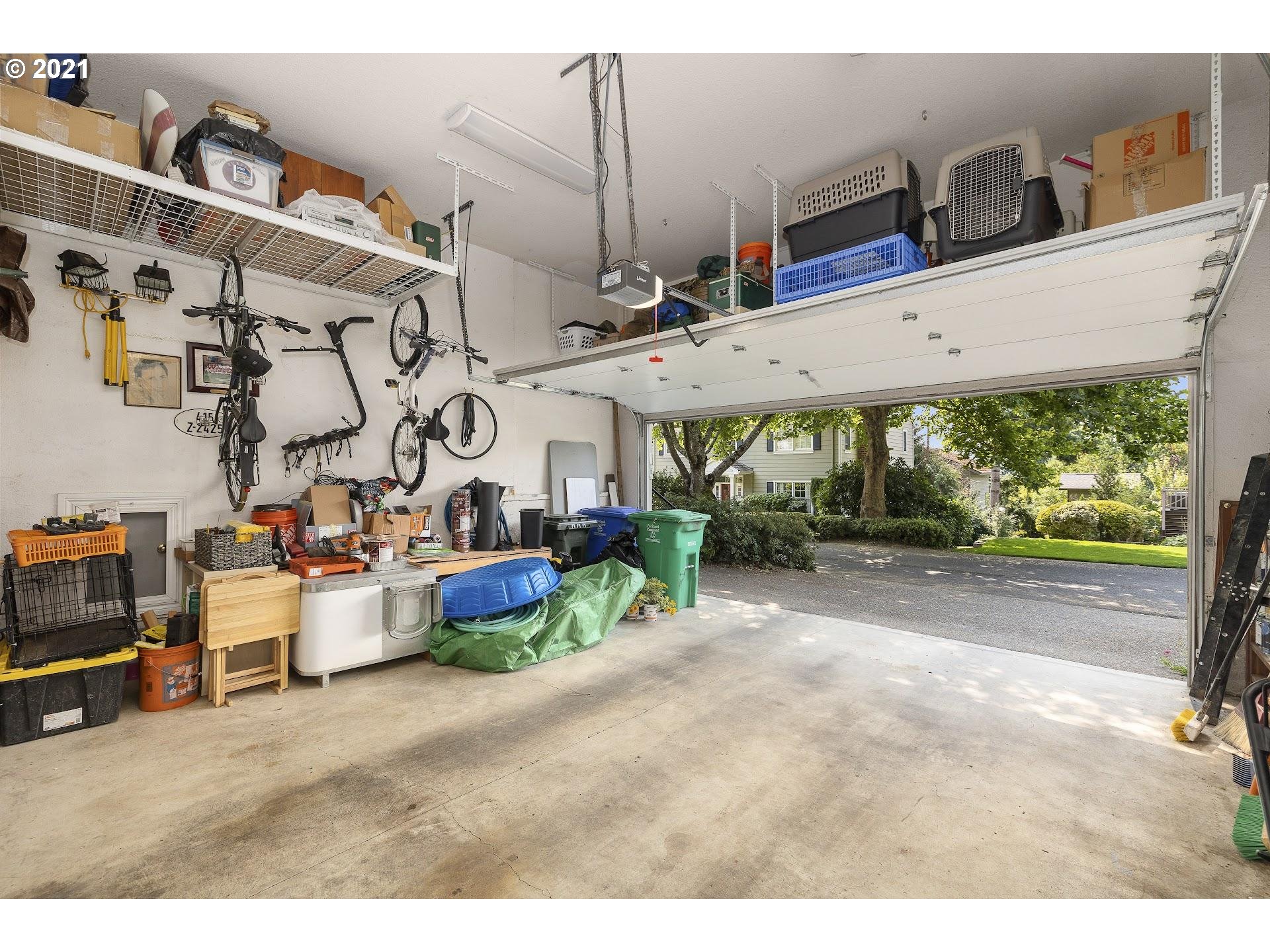 3916 Southwest Shattuck Road Portland, OR 97221 - Photo 27 of 28 a view of a patio with table and chairs