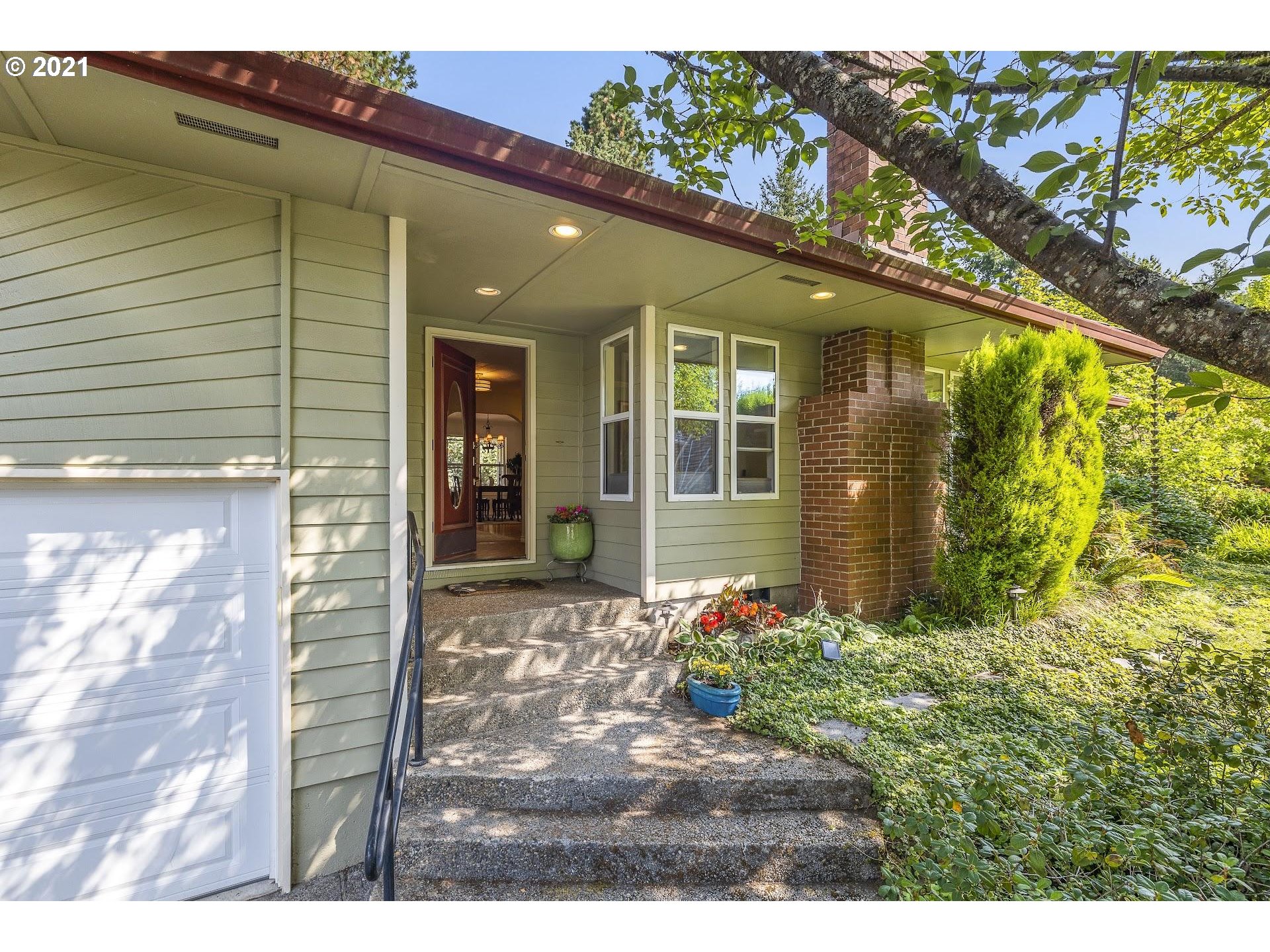3916 Southwest Shattuck Road Portland, OR 97221 - Photo 28 of 28 a view of a potted plants in front of a house