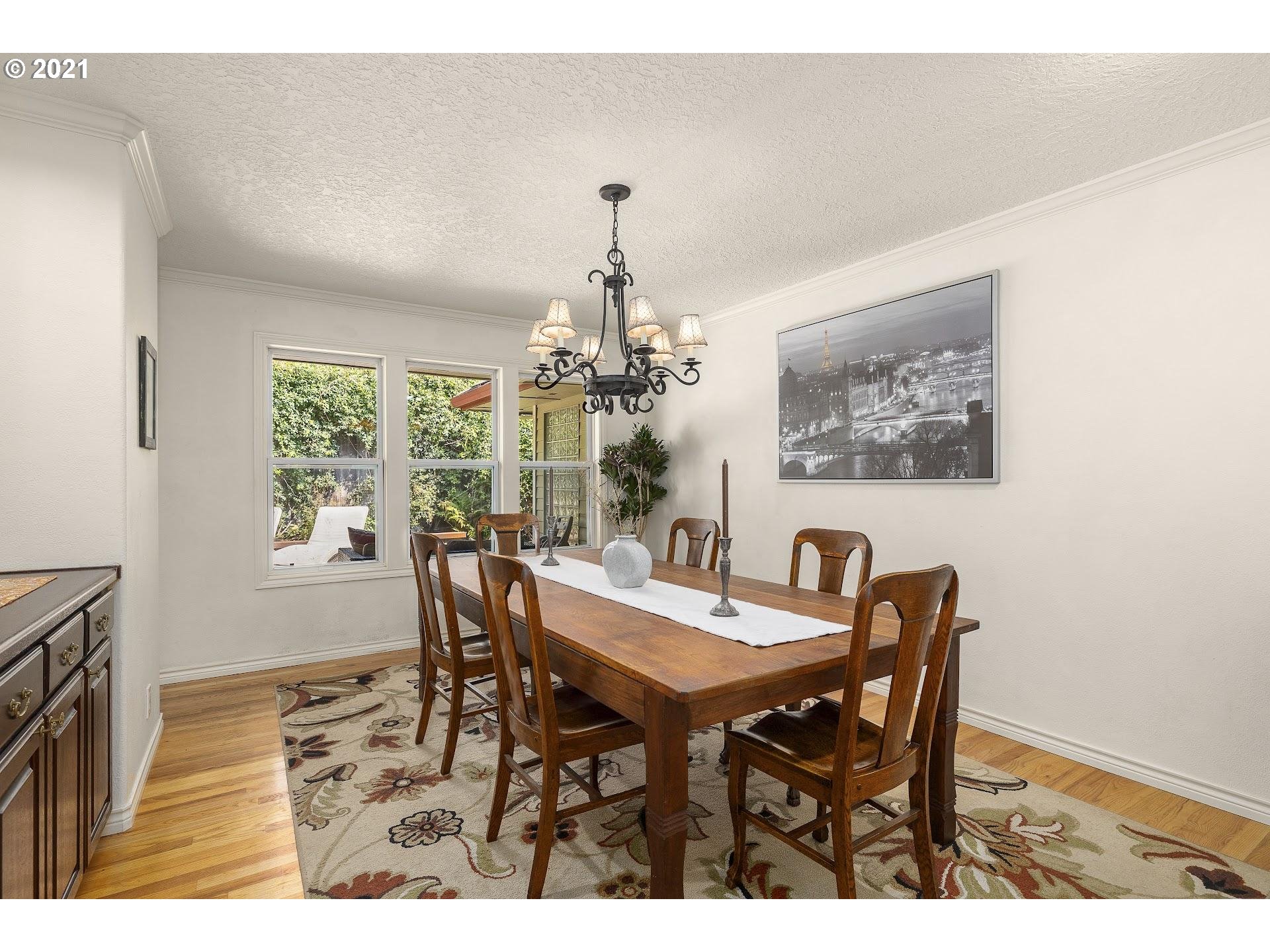 3916 Southwest Shattuck Road Portland, OR 97221 - Photo 10 of 28 a view of a dining room with furniture window and outside view