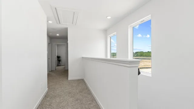 a view of an empty room and a window