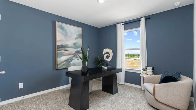 a living room with furniture and windows