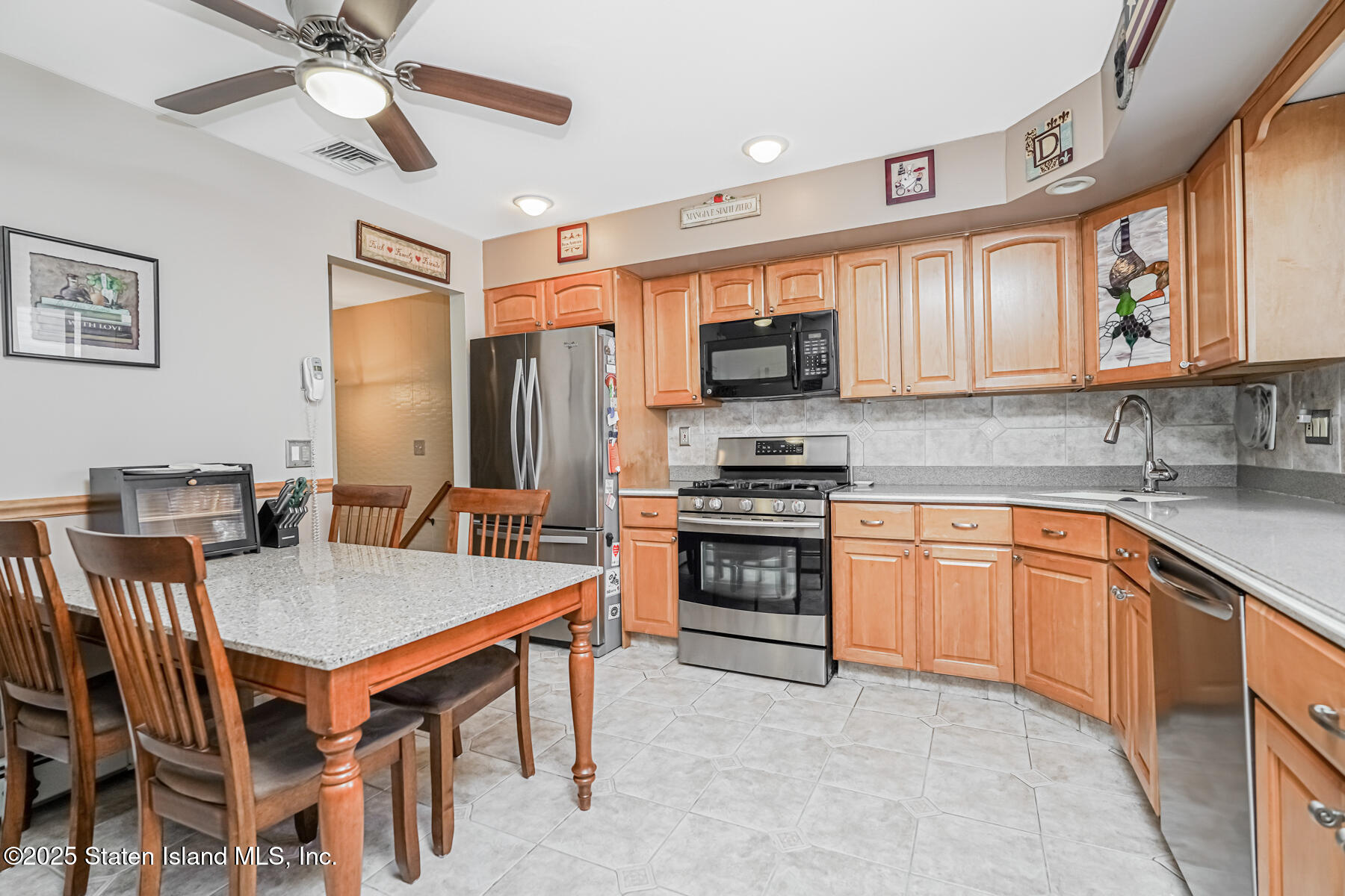 149 Rensselaer Avenue Staten Island, NY 10312 - Photo 13 of 33 a kitchen with stainless steel appliances granite countertop a stove a sink dishwasher and a refrigerator