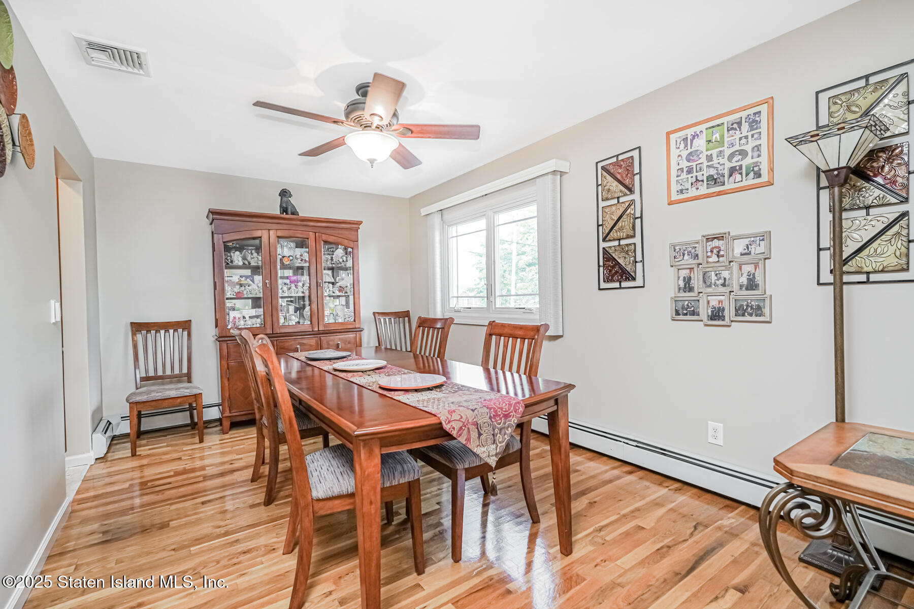 149 Rensselaer Avenue Staten Island, NY 10312 - Photo 16 of 33 a view of a dining room with furniture window and wooden floor