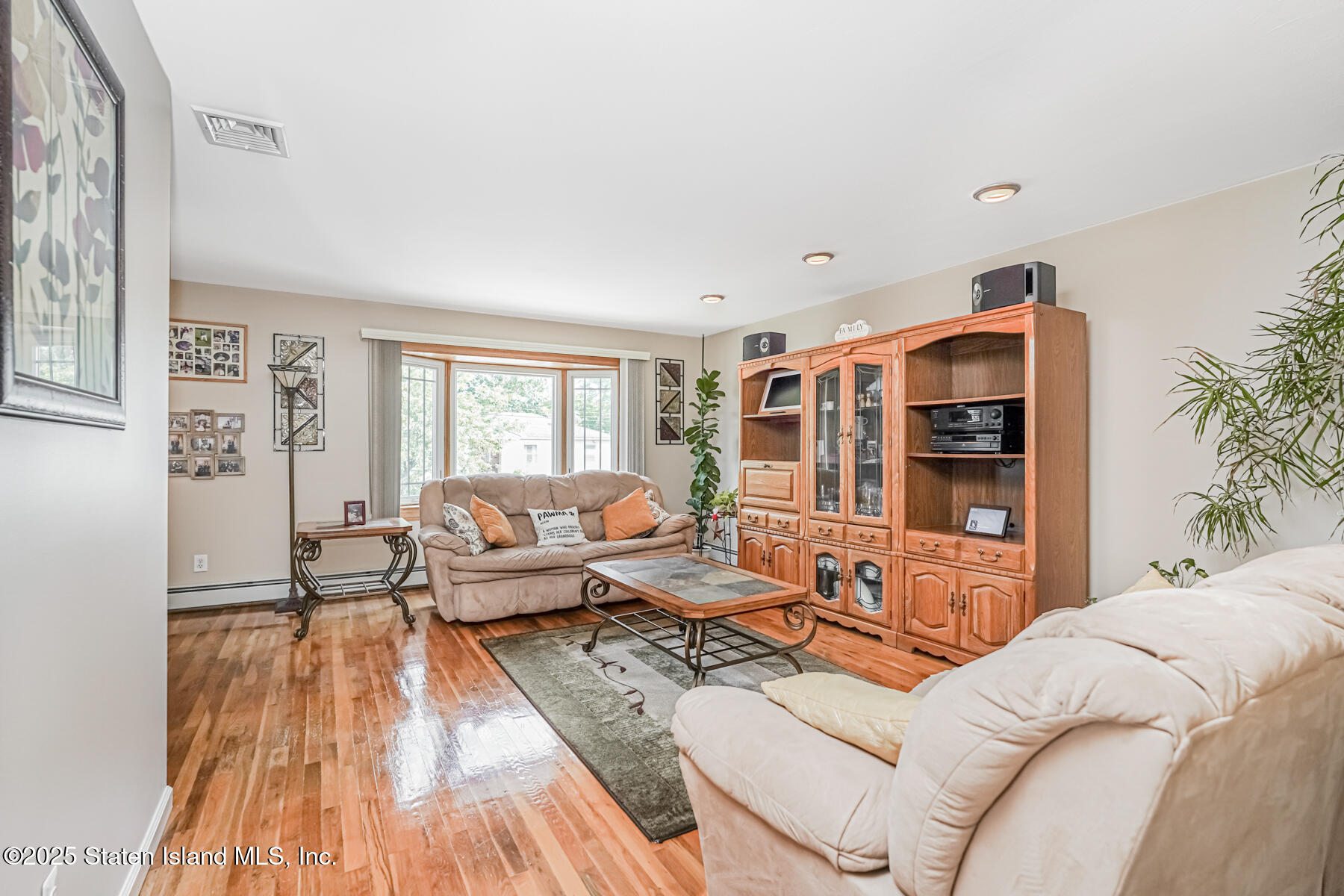 149 Rensselaer Avenue Staten Island, NY 10312 - Photo 19 of 33 a living room with furniture window and wooden floor