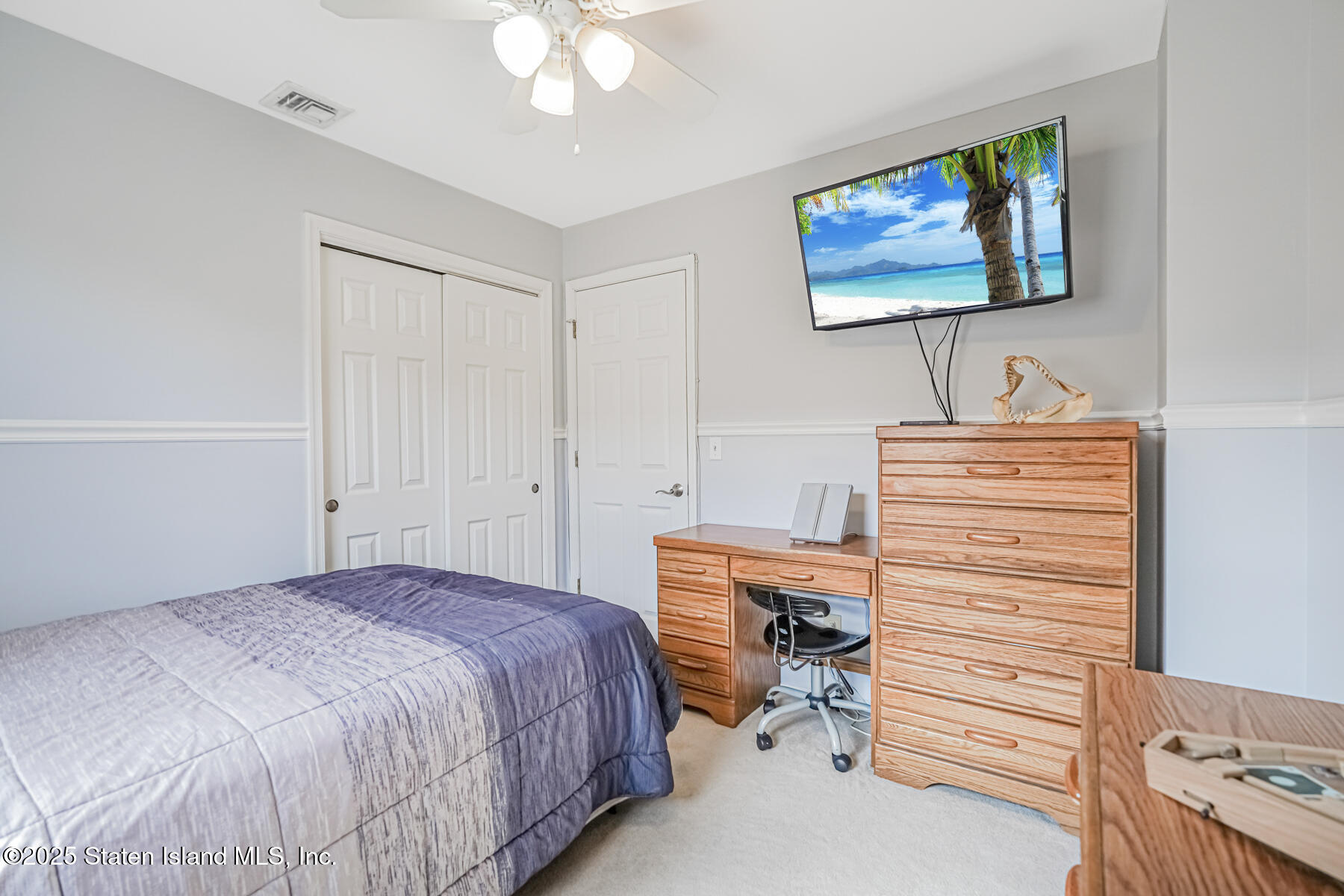 149 Rensselaer Avenue Staten Island, NY 10312 - Photo 25 of 33 a bedroom with a bed and a cabinets