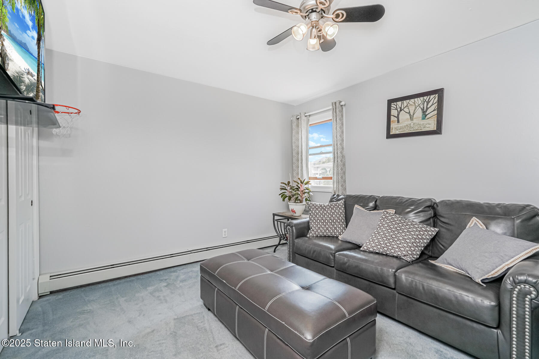 149 Rensselaer Avenue Staten Island, NY 10312 - Photo 26 of 33 a living room with furniture and a window