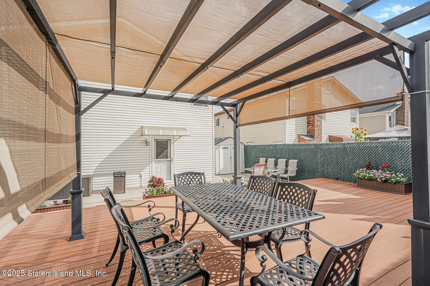 149 Rensselaer Avenue Staten Island, NY 10312 - Photo 29 of 33 a view of a balcony with table and chairs